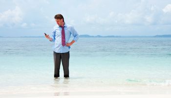 Small business executives want to be able to do business remotely, whether they are up to their necks in work, or up to their ankles in surf.